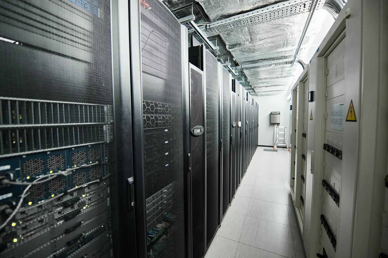 Rows of equipment cabinets in a modern server room